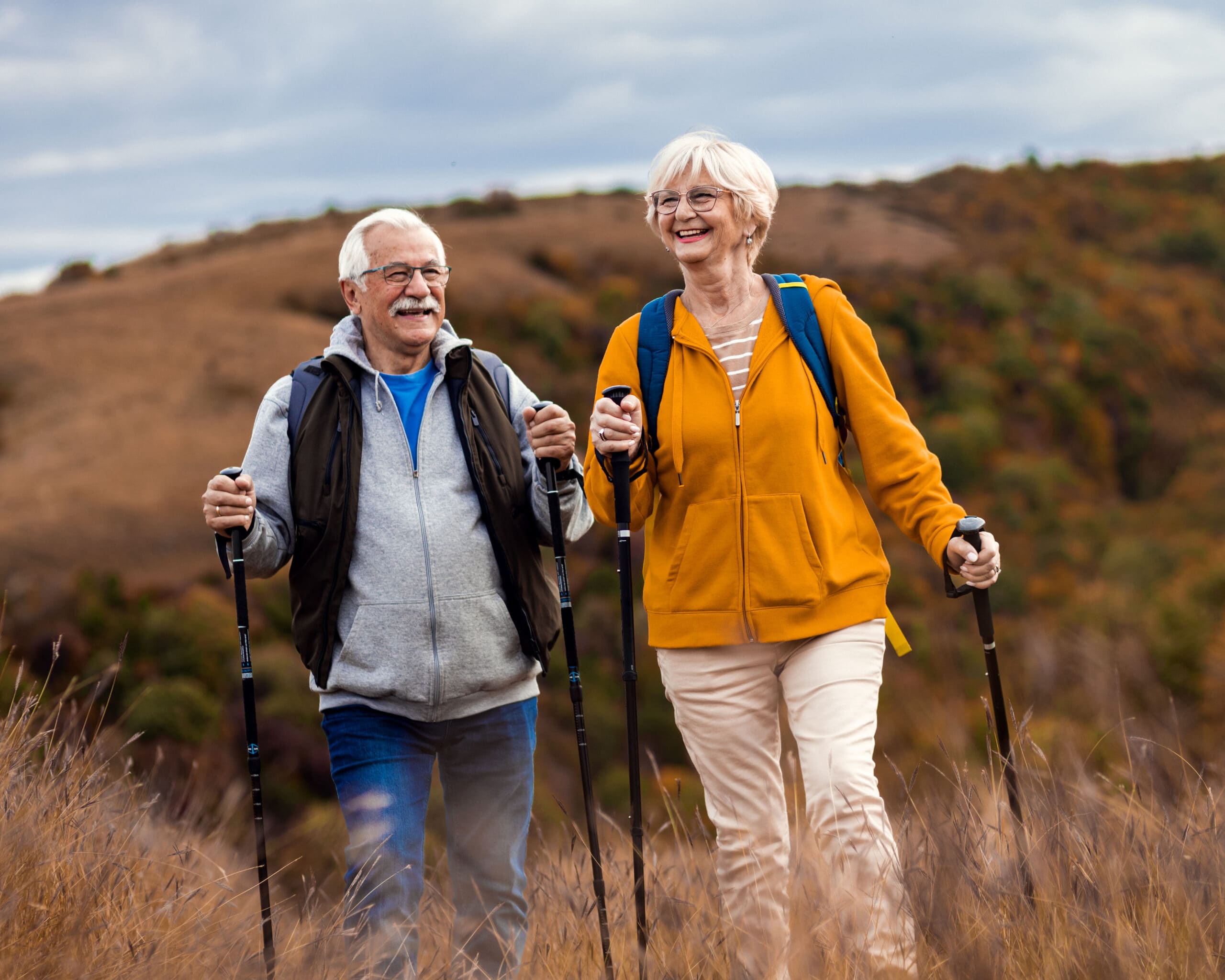 Elderly couple hiking outdoors